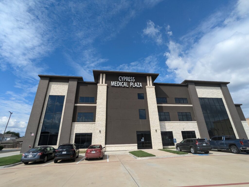 Modern building with 'Cypress Medical Plaza' sign